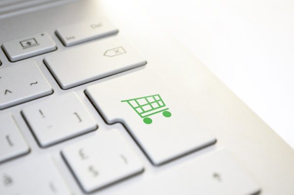 Laptop Keyboard with Shopping Cart Symbol